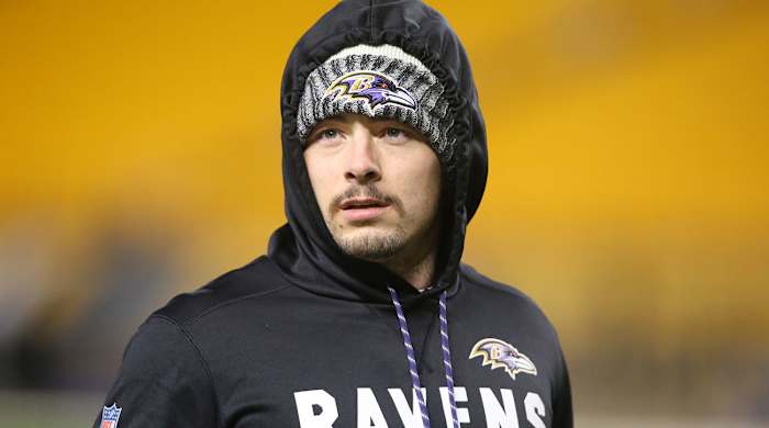 Danny Woodhead wearing a Ravens hoodie and hat.